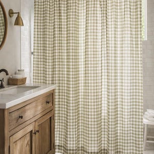 Cottagecore bathroom with green and white checkered shower curtain
