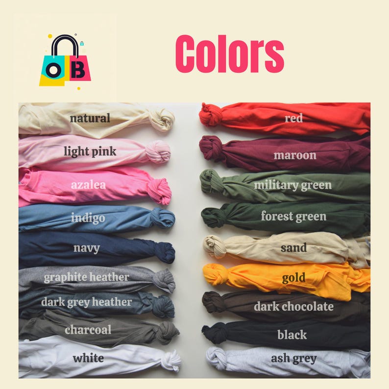 May include: A color chart showing 16 different colors of fabric swatches. The colors are: natural, light pink, azalea, indigo, navy, graphite heather, dark grey heather, charcoal, white, red, maroon, military green, forest green, sand, gold, dark chocolate, black, and ash grey.