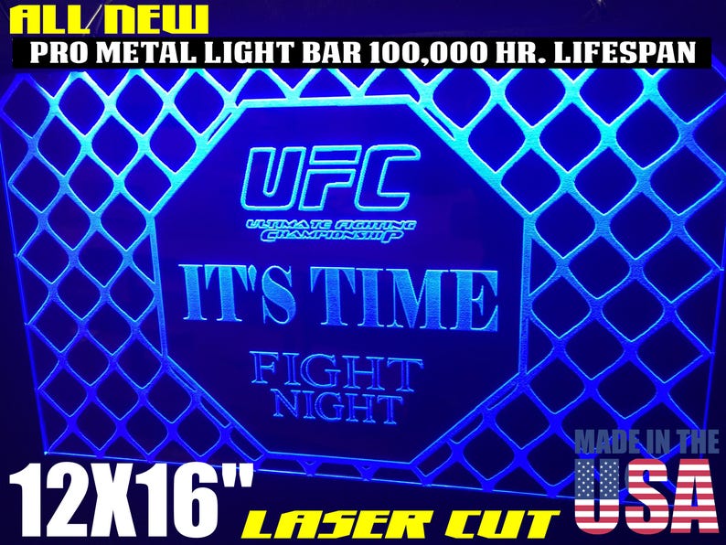 May include: A blue and white 12x16 inch laser cut sign with the UFC logo and the text "It's Time Fight Night". The sign is made in the USA.