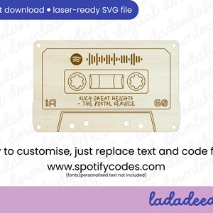May include: A laser-ready SVG file of a wooden cassette tape design. The design includes a Spotify logo, a scannable code, and the text "SUCH GREAT HEIGHTS - THE POSTAL SERVICE." The design also includes the text "Easy to customize, just replace text and code from www.spotifycodes.com."