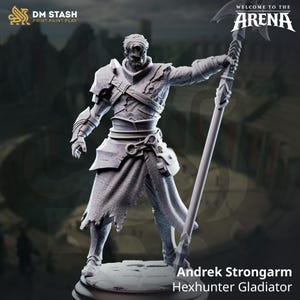 May include: A gray miniature figurine of a warrior named Andrek Strongarm, a Hexhunter Gladiator, holding a long polearm weapon. The figure wears textured armor, a tattered skirt, and stands on a circular base. Text includes DM STASH and WELCOME TO THE ARENA.