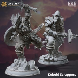 May include: Two grey 3D printed miniature figures of Kobold Scrappers, one wielding a sword and shield, the other holding a crossbow. The figures are posed in a dynamic action stance and are set on a rocky base.
