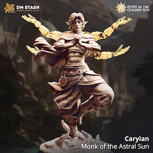 May include: A detailed figurine of Caryian, Monk of the Astral Sun, in a dynamic pose. The figure is clad in detailed robes and pants, with glowing golden energy emanating from the arms. The base features a textured, rocky surface. The image includes the text "DM STASH" and "ELVES OF THE GOLDEN SUN."