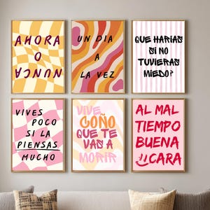 Puede incluir: Seis láminas enmarcadas con frases motivacionales en español. Las láminas presentan fondos coloridos y texto escrito a mano. Las frases incluyen "Ahora o Nunca" y "Un Dia a la Vez."