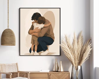 Può includere: Una stampa artistica da parete incorniciata raffigurante un'illustrazione digitale di una persona con camicia a maniche lunghe marrone e pantaloni blu scuro inginocchiata per abbracciare un bambino con t-shirt bianca e pantaloncini beige su sfondo beige.