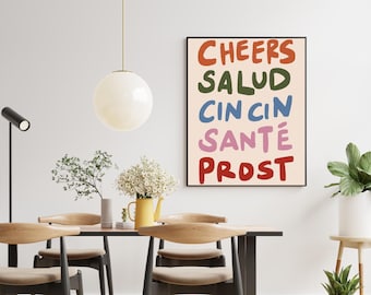 Può includere: Una stampa artistica da parete rettangolare con le parole CHEERS in arancione, SALUD in verde scuro, CIN CIN in blu, SANTÉ in rosa e PROST in rosso, scritte con un carattere audace, arrotondato e disegnato a mano su fondo crema.