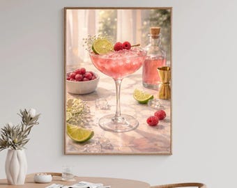 Può includere: Stampa incorniciata di un cocktail rosa con lamponi e lime. La bevanda è in un bicchiere a stelo, guarnita con una fetta di lime e lamponi. Sono visibili anche una piccola ciotola di lamponi, una bottiglia e un jigger.