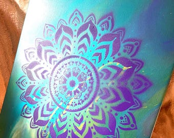A Large Purple Mandala on a Multi-Colored Acrylic Paint Pour Background Canvas