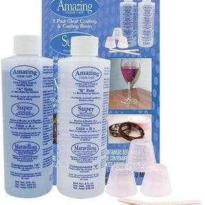 May include: Two clear bottles of Amazing Clear Cast 2-Part Clear Coating & Casting Resin. The bottles are labeled "A Side" and "B Side" and have a 1:1 mix ratio by volume. The bottles are 8 fl. oz. each. The product is for making molds and casting resin.
