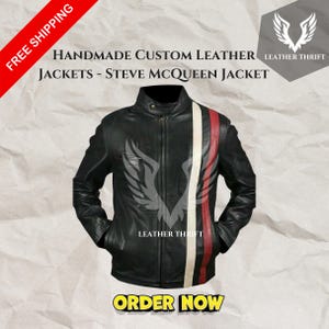 May include: Black leather jacket with a vertical white and red stripe design. The jacket has a zipper closure and a stand-up collar. The text "HANDMADE CUSTOM LEATHER JACKETS - STEVE MCQUEEN JACKET" is visible.
