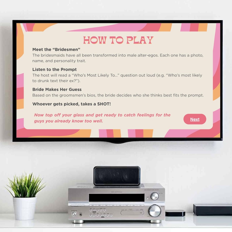 May include: A television screen shows game instructions with a pink, orange, and beige design. The text reads "How to Play" and details the game's rules. Below the TV, a stereo system, a speaker, and a potted plant are visible.