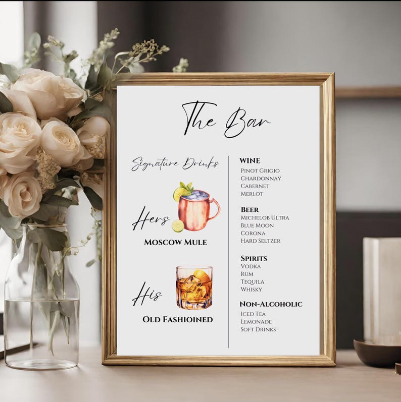 May include: A printable sign for a wedding or party bar with the text "The Bar" and "Signature Drinks". The sign lists a variety of alcoholic and non-alcoholic beverages, including wine, beer, spirits, and non-alcoholic options. The sign also features illustrations of a Moscow Mule and an Old Fashioned.