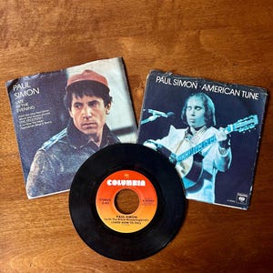 Vintage Paul Simon set of 3 collectible 45 records,  includes two picture sleeves, Late in the Evening, American Tune, Loves me like a rock,