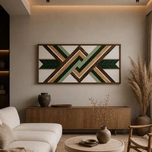 May include: A rectangular wall art piece featuring a geometric pattern of interlocking wooden slats in shades of dark green, sage green, natural wood grain, and white, all enclosed within a dark brown wooden frame mounted on a neutral wall.