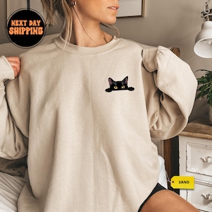 猫のスウェットシャツ、かわいい猫のスウェットシャツ、黒猫のシャツ、猫が覗くスウェットシャツ、レディースの面白いスウェットシャツ、猫好きへのギフト、猫ママのスウェットシャツ