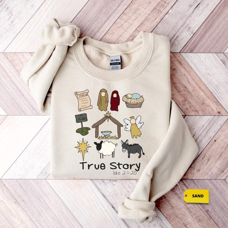 a sweater with a picture of a nativity scene on it