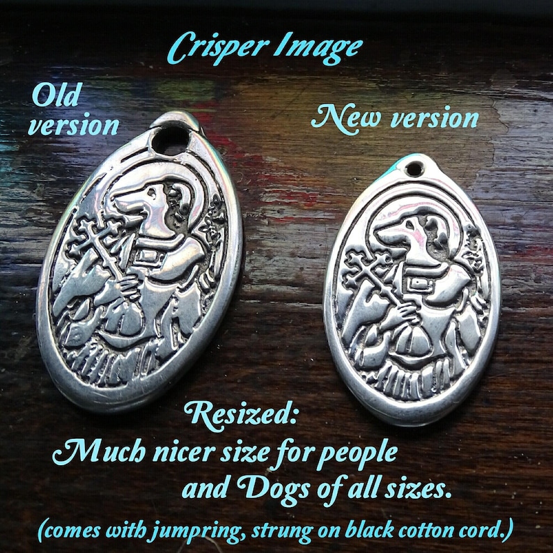 May include: Two silver oval dog charm pendants, one larger than the other. The larger pendant is labeled "Old version" and the smaller pendant is labeled "New version". The text "Resized: Much nicer size for people and Dogs of all sizes. (comes with jumpring, strung on black cotton cord.)" is below the pendants.