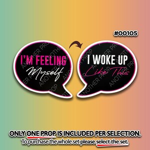 May include: Two black speech bubble props with white and pink accents. One says "I'M FEELING Myself" and the other says "I WOKE UP Like This". The props are on a gradient background of pink, yellow, and green.