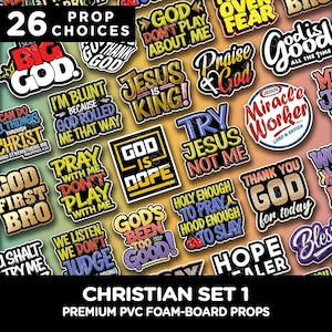 May include: A collection of 26 Christian-themed PVC foam-board props. The props feature various phrases and words, including "God," "Jesus," and inspirational quotes in a variety of colors and fonts. The set is labeled "Christian Set 1."
