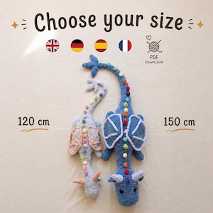 May include: Two crocheted dragon toys, one light gray and the other blue, are displayed against a neutral background. The blue dragon is 150 cm long, and the gray dragon is 120 cm long. The text "Choose your size" is at the top.