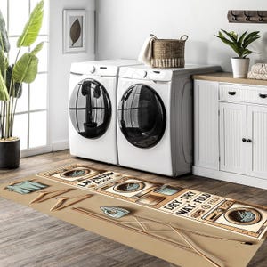 May include: A brown and beige laundry room rug with a vintage design featuring illustrations of washing machines, an iron, and hangers. The text on the rug reads "Laundry Room" and "Dry-Dry Way-Fold".