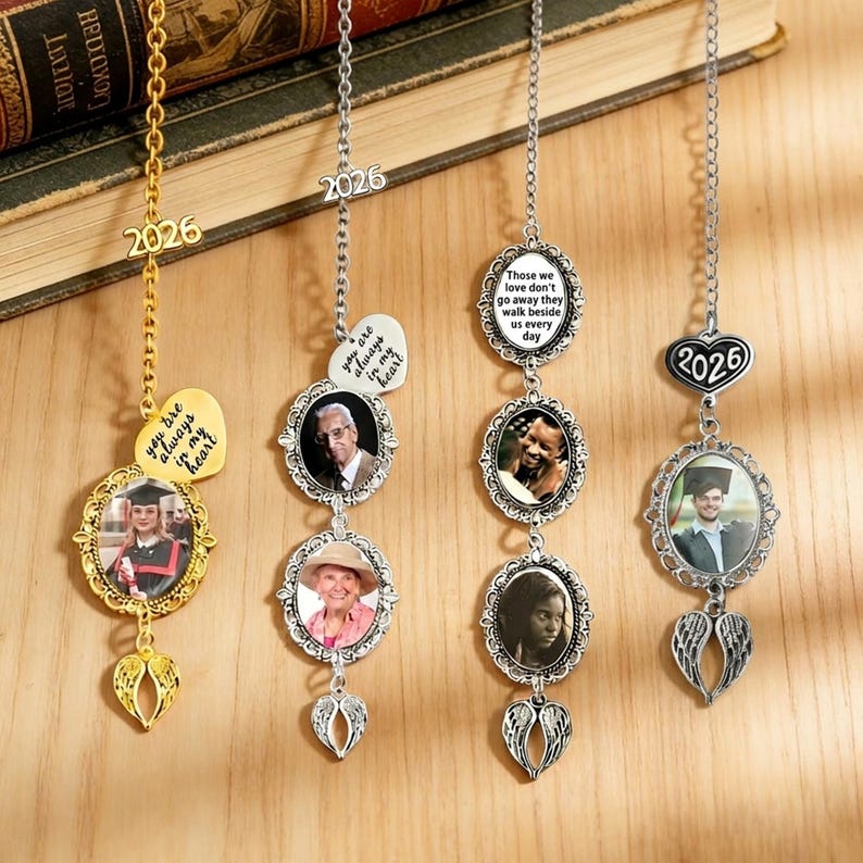 May include: Four personalized photo ornaments with chains. Each ornament features a photo in an ornate frame, with angel wings and a year charm. One gold ornament has the text "You are always in my heart".