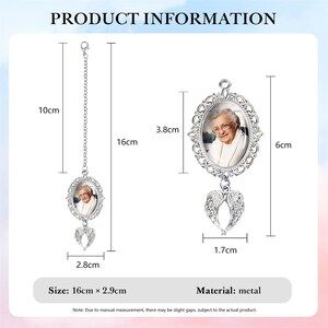 May include: Metal memorial ornament featuring a photo within an oval frame, adorned with decorative detailing and angel wings. The ornament is 6.3 inches long and 1.1 inches wide. The product information is displayed in the image.