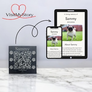 May include: A black slate memorial plaque with a QR code and the text "Sammy" and "VisitMyStory". The plaque is next to a smartphone and tablet displaying a photo of a pug with the text "In loving memory of Sammy 2012-2024" and "About Sammy".