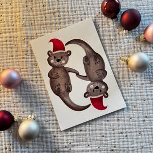 Otter Weihnachtskarte – Handgemaltes Aquarellmotiv | A6 Karte | Ostkarte Weihnachten | Postkarte | Weihnachtskarten Tiere | Otter Karte