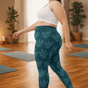 May include: Teal leggings with a white leaf pattern, paired with a white sports bra and sneakers. The leggings have a high waistband and a repeating design of stylized leaves. The outfit is suitable for yoga or other fitness activities.