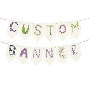 May include: A custom banner with the word "CUSTOM BANNER" spelled out with flowers on individual cream-colored pennants. The flowers are various colors, including purple, white, and green, against a white background.