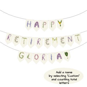 May include: A banner with the words "HAPPY RETIREMENT GLORIA!" spelled out with floral letters. The banner is cream-colored and strung on a thin wire. Text at the bottom says "Add a name by selecting 'Custom' and counting total letters."