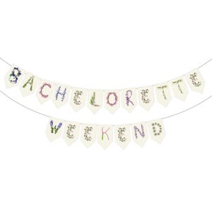 Custom floral paper banner spelling "BACHELORETTE WEEKEND" in delicate pink, sage green, and cream botanical letters. Personalized party decoration featuring pressed flower and leaf designs, perfect for bachelorette parties, bridal celebrations, and girls' weekend getaways. Elegant nature-inspired garland.