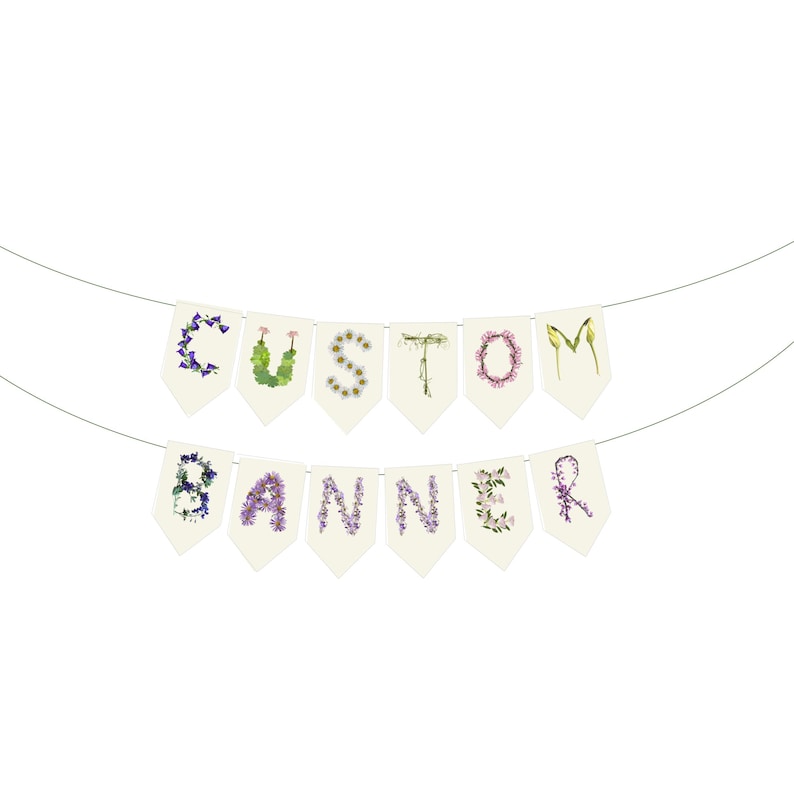 May include: A custom banner with the word "CUSTOM BANNER" spelled out on individual cream-colored pennants. Each letter is formed with colorful flowers and foliage, strung on a thin wire against a white background.