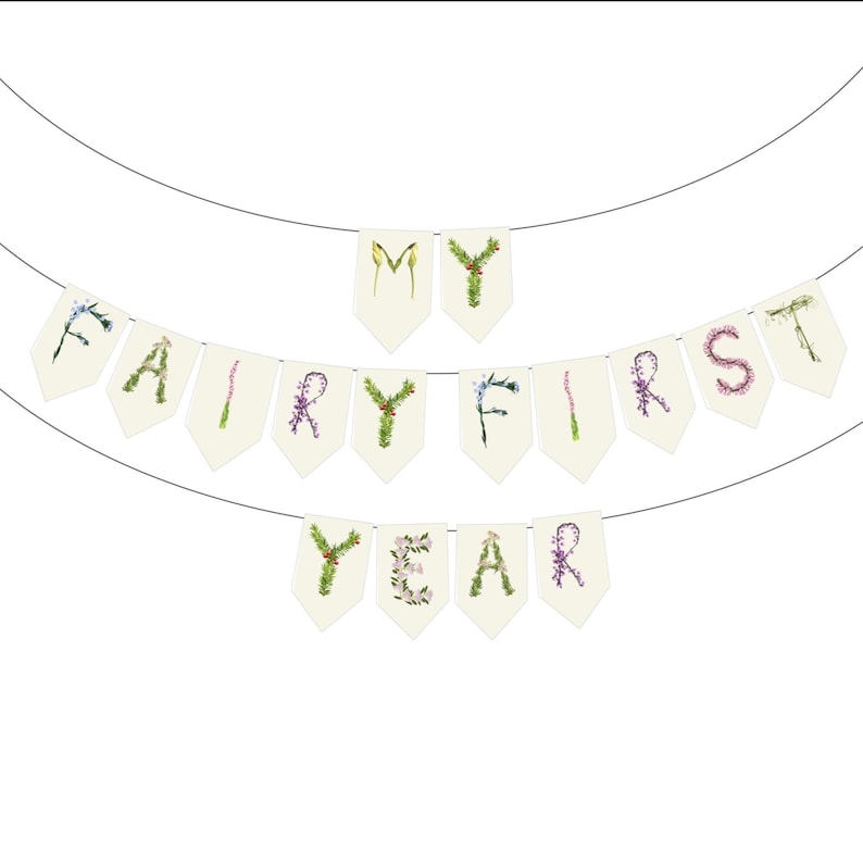 May include: A banner with the words "MY FAIRY FIRST YEAR" spelled out on individual pennants. The letters are decorated with floral and botanical elements, strung on a thin wire against a white background.