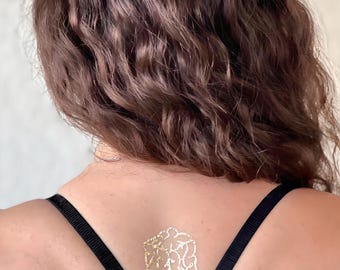 Gold temporary tattoo