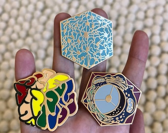 A set of 3 neuro enamel pins