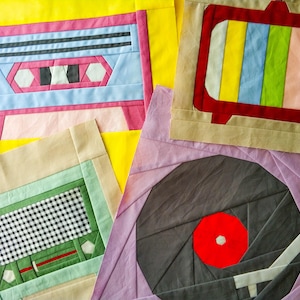 May include: A patchwork quilt featuring various coloured fabric squares depicting vintage electronics, including a cassette player, a radio, and a record player.
