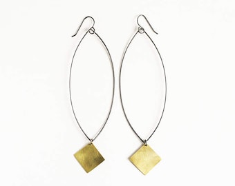 Long black and brass drop earrings