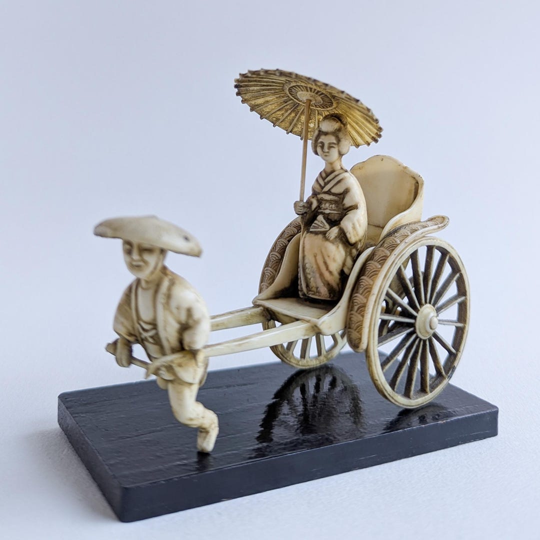 Celluloid Geisha, Vintage Celluloid Man Pulling Geisha ,lady Woman in a