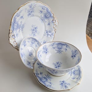 Set of Four Vintage Transferware Pieces with Gold Rim, Blue and White Ceramic Plates and Bowl Set