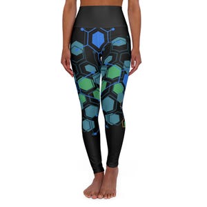 May include: Black yoga leggings with a geometric pattern of blue, green, and orange hexagons connected by lines.