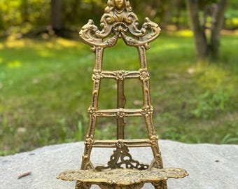 Vintage Solid Brass Gold Tone Art Nouveau Rococo Baroque Victorian Style Table Top Display Easel with Lion feet & Cherub