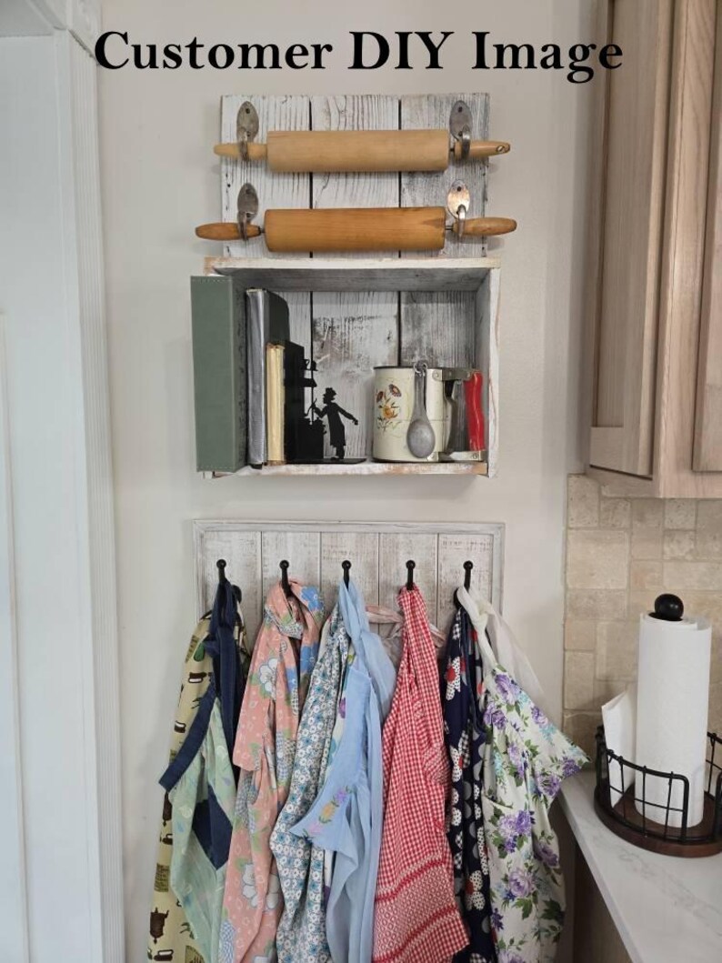May include: A rustic kitchen storage unit with a shelf holding books and a mug, and a lower rack with aprons hanging from hooks. Two rolling pins are mounted above the shelf. The text "Customer DIY Image" is at the top.