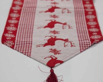 Camino de mesa navideño de lino con diseño de renos y borlas para la temporada festiva navideña.