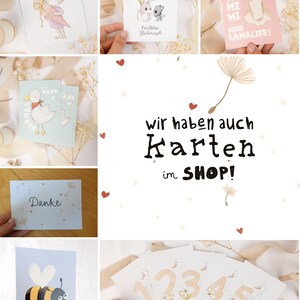 May include: A collection of greeting cards featuring various illustrations including a cat, rabbits, a llama, a duck, a bee, and numbers. The central text reads: WIR HABEN AUCH KARTEN im SHOP! Other cards display text such as Hipp Hipp Hurra, Herzlichen Gl&uuml;ckwunsch, Danke, and BEE HAPPY.