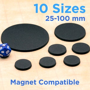 May include: Ten black round bases for miniature figures, ranging in size from 25 to 100 millimeters. The bases are made of a material that is compatible with magnets.