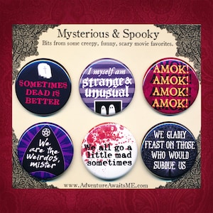 May include: Six round buttons with different designs and quotes from horror movies. The buttons are black, purple, red, white, and pink with black and white stripes. The quotes include "Sometimes Dead is Better", "I myself am strange & unusual", "AMOK! AMOK! AMOK! AMOK!", "We are the Weirdos, mister", "We all go a little mad sometimes", and "We gladly feast on those who would subdue us".