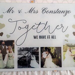 May include: A personalized wedding photo display featuring the names "Mr & Mrs Constanzo" and the word "Together". The display includes four wedding photos and decorative hearts in shades of green and brown.