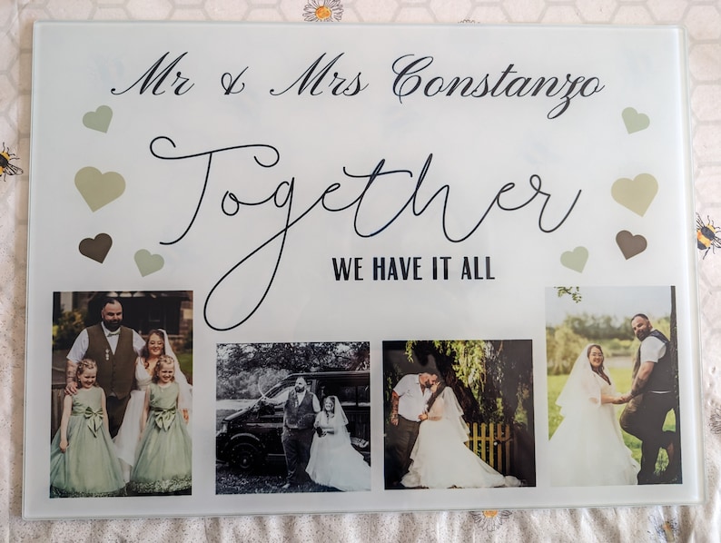 May include: A personalized wedding photo display featuring the names "Mr & Mrs Constanzo" and the word "Together". The display includes four wedding photos and decorative hearts in shades of green and brown.
